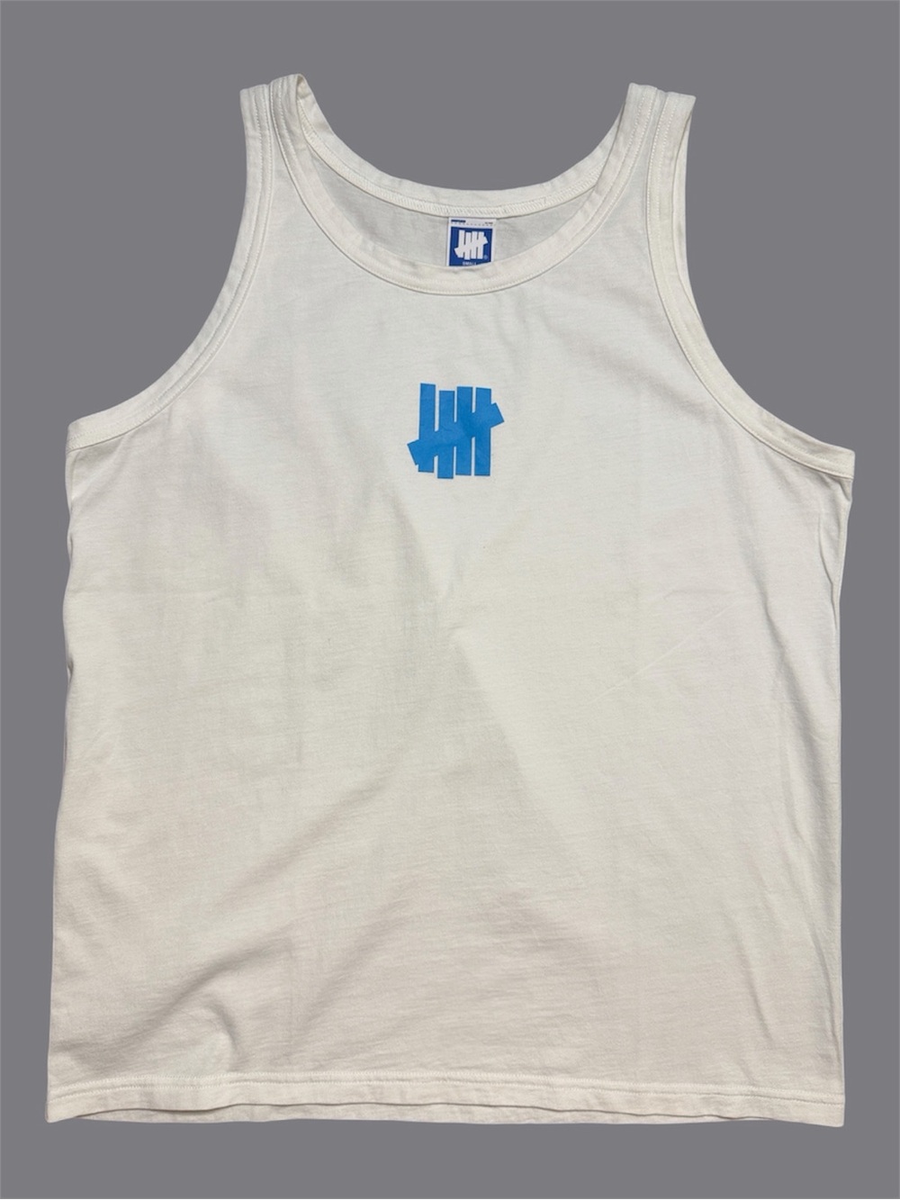 Undefeated White Tank with Blue Logo Center